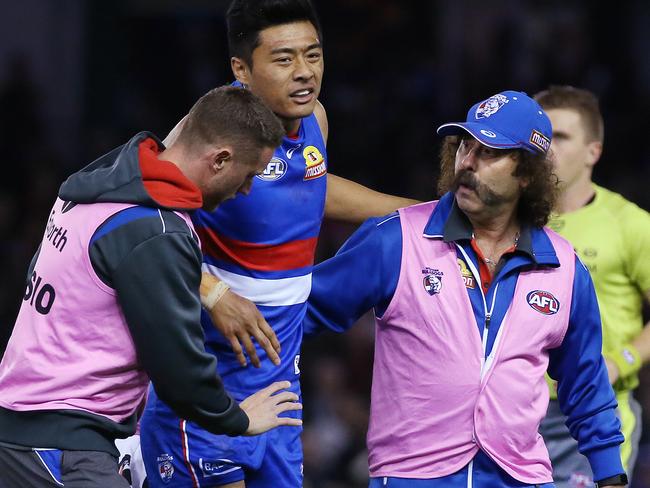 AFL : Round 13 : Western Bulldogs vs. Melbourne at Etihad Stadium, 18th June, , Melbourne Australia.  Western Bulldogs Lin Jong comes off injured in the first quarter.Picture : George Salpigtidis