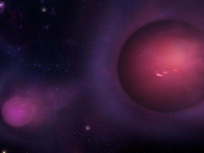 Dull ‘spitballs’ of gas about the size of Jupiter may be being hurled out of the Milky Way by the black hole at its centre. Picture: CFA