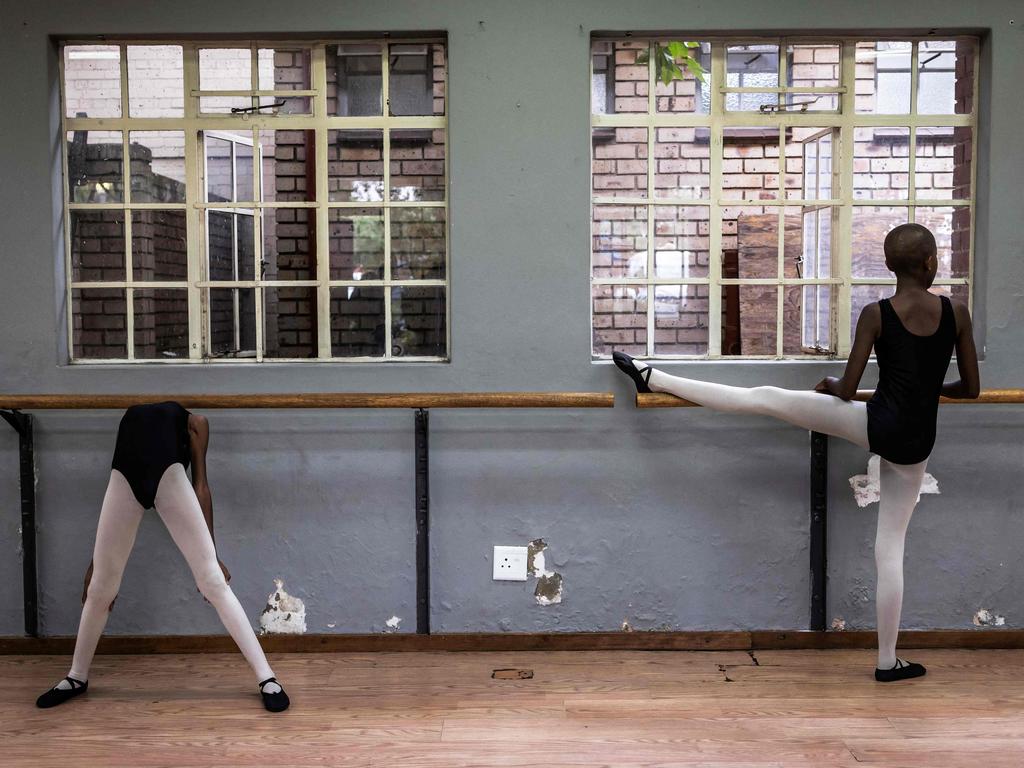 In Soweto, near Johannesburg, pupils stretch before ballet class. Jo-Anne Wyngaard, ballet instructor for Joburg Ballet, aims to cultivate world-class dancers from diverse backgrounds. Picture: Olympia De Maismont/AFP