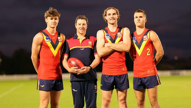 South Australia’s under-18 boys leadership group, from left, vice-captain Sam Cumming, coach Tony Bamford, captain Dyson Sharp and vice-captain Jack Cook. Picture: Cory Sutton/SANFL