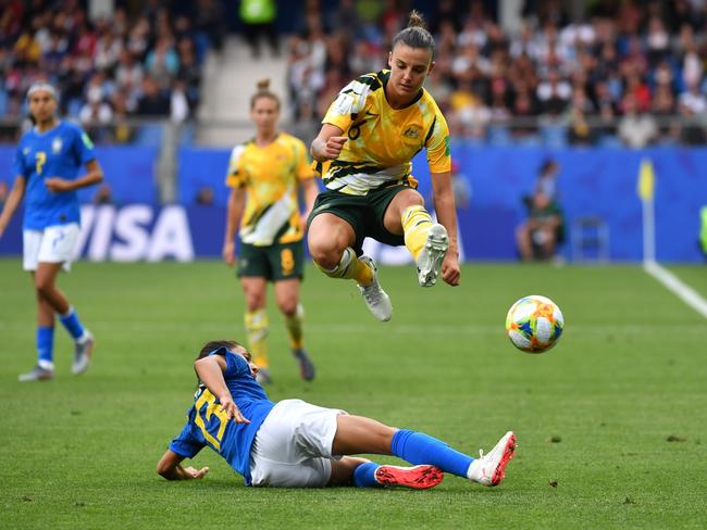 Brazil's defender Leticia Santos (down) tackles  Australia's midfielder Chloe Logarzo (up) during the France 2019 Women's World Cup Group C football match between Australia and Brazil, on June 13, 2019, at the Mosson Stadium in Montpellier, southern France. (Photo by Pascal GUYOT / AFP)