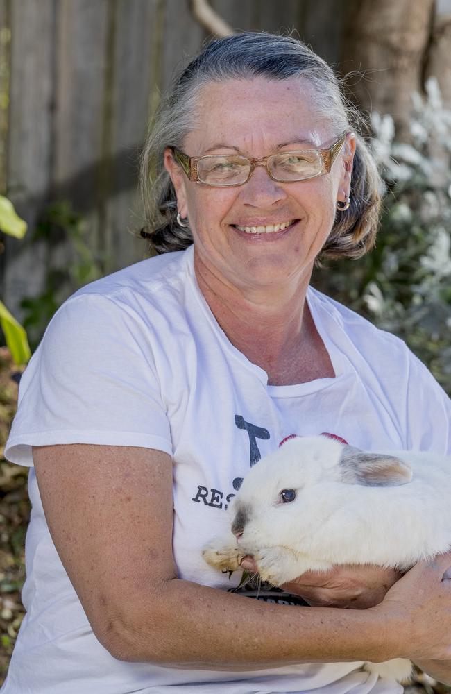 Anna Nikolic moved interstate to be able to keep rabbits as pets and now helps rescue them from Tweed Heads. Anna Nikolic holding Chopper. Picture: Jerad Williams