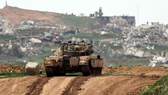 An Israeli army battle tank moving in the Palestinian territory. Israel said it is “at war with Hamas, not the Palestinian people”. Picture: AFP