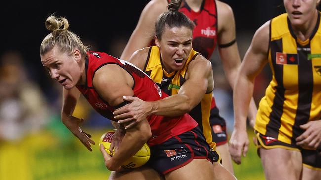 Star Hawthorn recruit Emily Bates tackles Bomber Jacqueline Vogt on Saturday night. Picture: Daniel Pockett/Getty Images