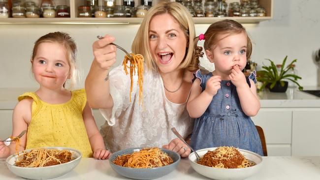 Mum Kirsten Aldcroft, with daughters Ruby, 4 and Evie, 2, have taken advantage of the Coles Dropped and Locked campaign with the price of beef taking a hit. Picture: Nicki Connolly