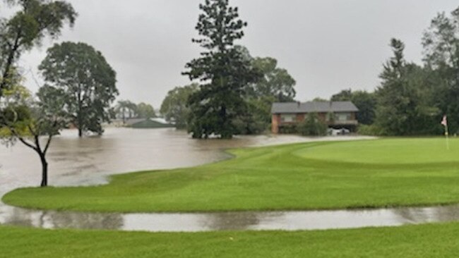 Houses and a shed next to the Lismore Golf Course were inundated on May 28, 2022.