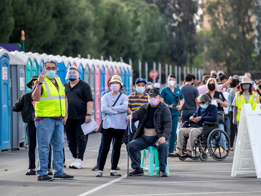 People wait in a Disneyland car park to receive Covid vaccines. Picture: Valerie Macon/AFP