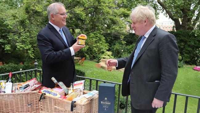 Prime Minister Scott Morrison and UK Prime Minister Boris Johnson signing off on the new free trade agreement between Australia and the UK.