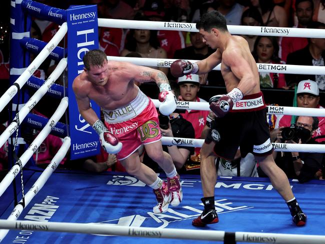 LAS VEGAS, NEVADA - MAY 07: Dmitry Bivol (R) punches Canelo Alvarez during their WBA light heavyweight title fight at T-Mobile Arena on May 07, 2022 in Las Vegas, Nevada. Bivol retained his title by unanimous decision. (Photo by Ethan Miller/Getty Images)