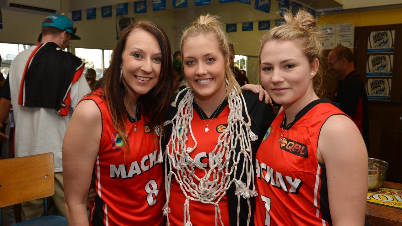 Jaye Willis (middle) celebrating the Meteorettes’ 2012 QBL win. Photo Peter Holt / Daily Mercury