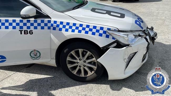 A police car was seriously damaged after it was rammed in a car containing Sines Manton on the Pacific Highway on April 29, 2021.