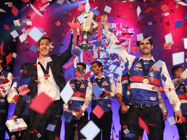 MELBOURNE, AUSTRALIA - OCTOBER 01: Robert Murphy of the Bulldogs and Easton Wood of the Bulldogs celebrate with the 2016 AFL Premiership Cup during the Western Bulldogs 2016 AFL Premiership Cup celebrations after the AFL Grand Final at the Melbourne Convention and Exhibition Centre on October 1, 2016 in Melbourne, Australia. (Photo by Scott Barbour/Getty Images)