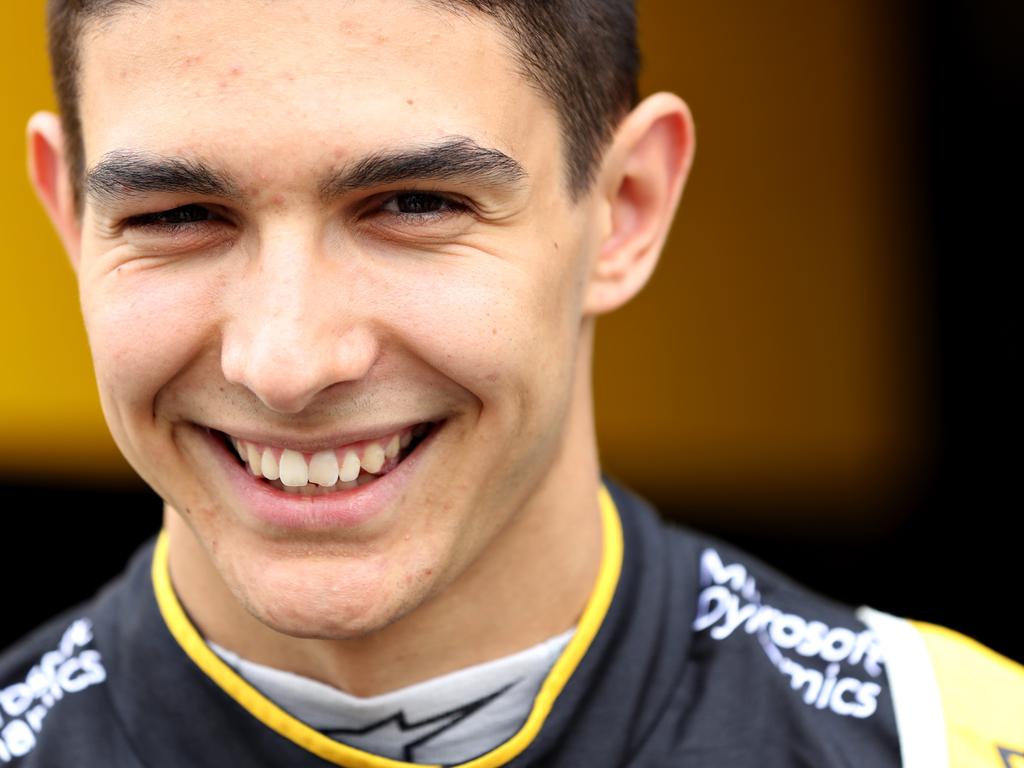 Esteban Ocon in the old colours again.