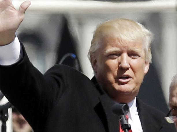 FILE - In this April 1, 2014, file photo, Donald Trump, left, is joined by Carl Paladino during a gun rights rally at the Empire State Plaza in Albany, N.Y. Paladino, who co-chaired president-Elect Donald Trump's state campaign, confirmed to The Associated Press on Friday, Dec. 23, 3016 that he told a New York alternative newspaper he hoped President Barack Obama would die from mad cow disease and that the first lady would 