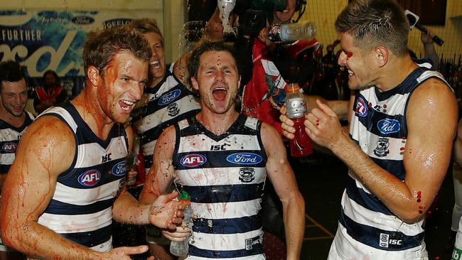 Geelong recruits Lachie Henderson, Patrick Dangerfield and Zac Smith celebrate after their first win for their new club in Round 1, 2016. Picture: Wayne Ludbey