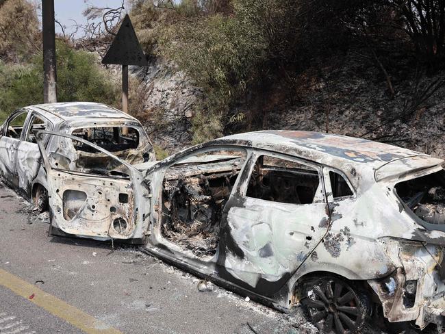 Cars burned during an infiltration by Palestinian militants from the Gaza Strip. Picture: AFP