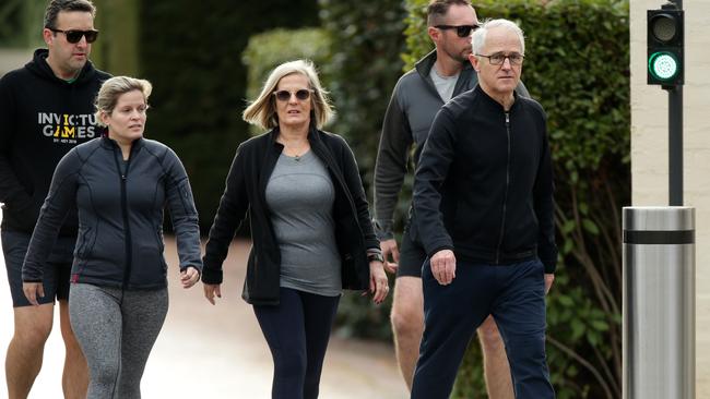 Former prime minister Malcolm Turnbull with wife Lucy and daughter Daisy leaving The Lodge in Canberra for a walk. Picture Jonathan Ng