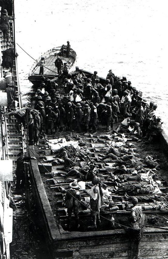 The first of the battle-torn ANZACs return to waiting ships off the Gallipoli Peninsula.