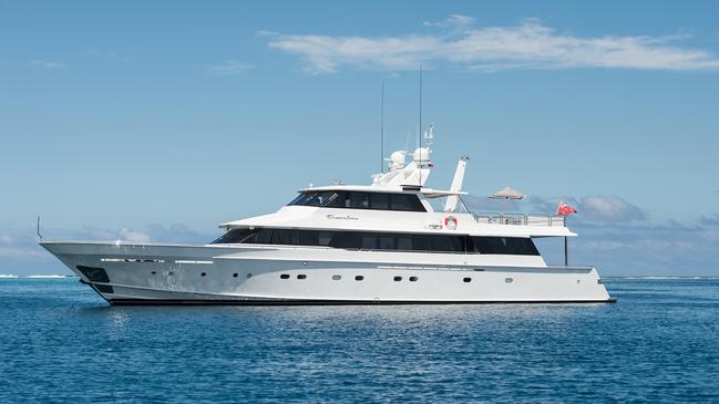 Four people who snuck into Queensland on superyacht Dreamtime from Sydney were fined.