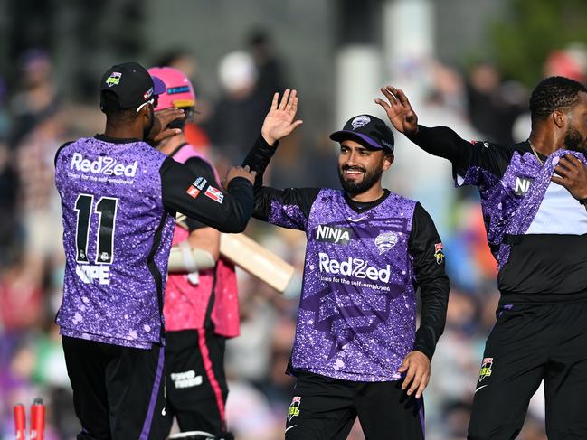 HOBART, AUSTRALIA - JANUARY 01: Waqar Salamkheil, Shai Hope and Chris Jordan of the Hurricanes celebrates the win during the BBL match between the Hobart Hurricanes and Sydney Sixers at Blundstone Arena, on January 01, 2025, in Hobart, Australia. (Photo by Steve Bell/Getty Images)