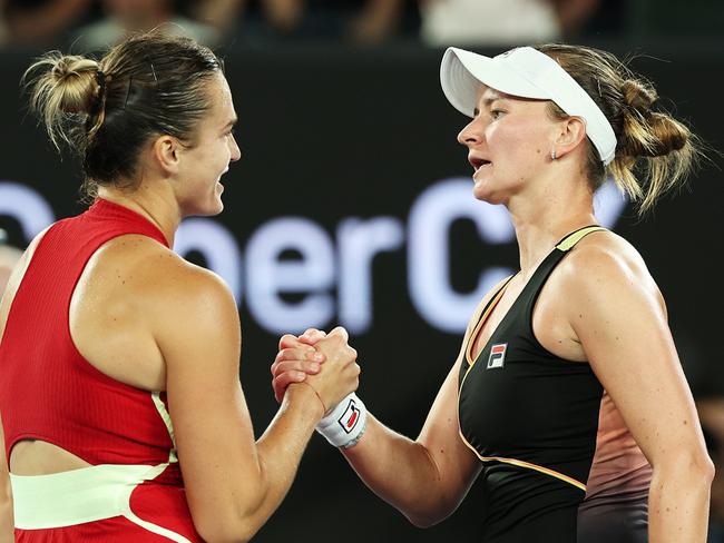 MELBOURNE, AUSTRALIA - JANUARY 23: Aryna Sabalenka (L) embraces Barbora Krejcikova of Czech Republic after winning their quarterfinals singles match during the 2024 Australian Open at Melbourne Park on January 23, 2024 in Melbourne, Australia. (Photo by Cameron Spencer/Getty Images)