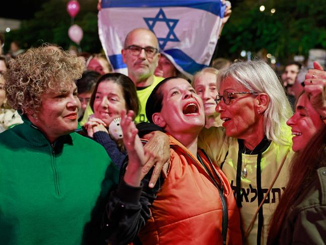 Supporters and relatives of hostages held captive in the Gaza Strip react while watching a live television broadcast on the release of Israeli hostages. Picture: Menahem Kahana/AFP