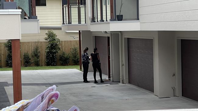 Police on scene at a townhouse complex in Morningside after a bullet was fired at a balcony. Picture: Matthew Johnston