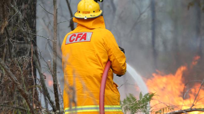 Fire crews fight a spot fire east of Nowa Nowa on New Year’s Day. Picture: David Crosling