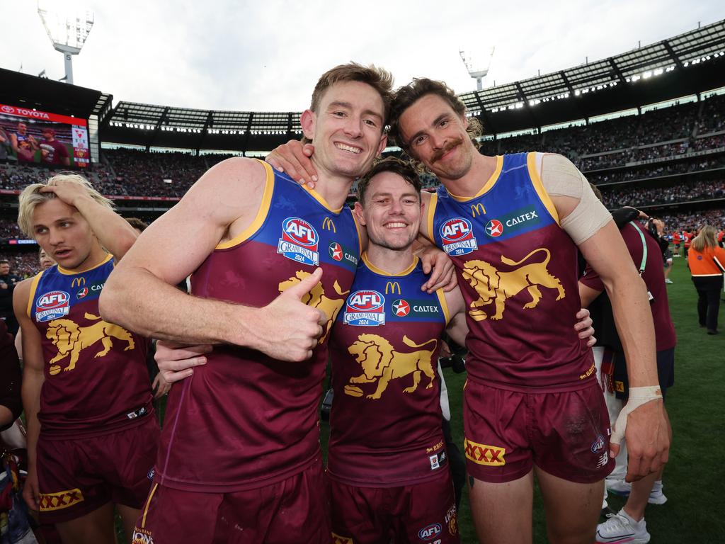 Joe Daniher right) celebrates Brisbane’s AFL grand final win with Lions co-captains Harris Andrews (left) and Lachie Neale. Picture: David Caird