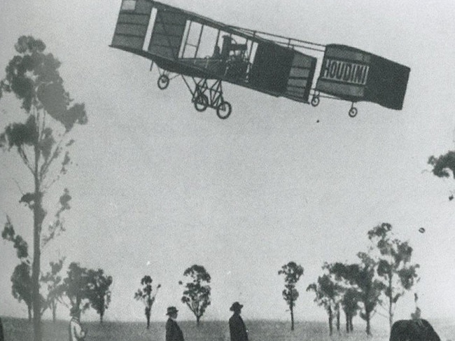 Harry Houdini flies across a paddock in Australia in 1910.