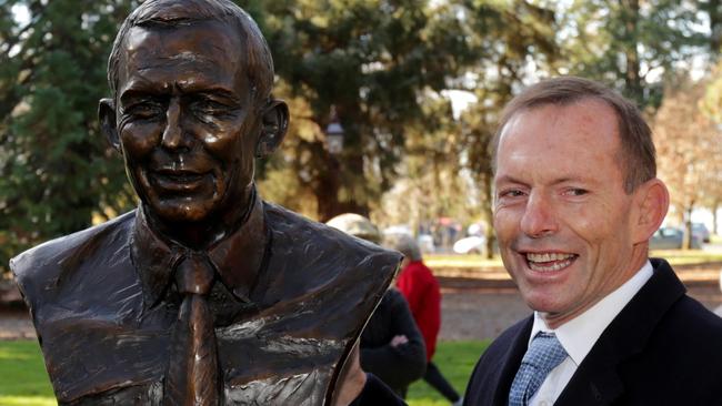 Former prime minister Tony Abbott and his bust on the Prime Ministers Ave in Ballarat. Picture: Stuart McEvoy