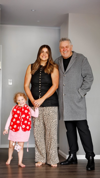 Ray Hadley's granddaughter plays with her sibling