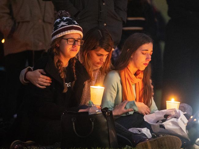 Mourners at a memorial for Eurydice Dixon in Elder Park, Adelaide. Picture: Matt Turner