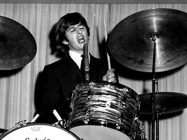 British singer musician Ringo Starr playing drums as part of the Beatles music group in Brisbane during tour of Australia 1964. Picture: News Corp