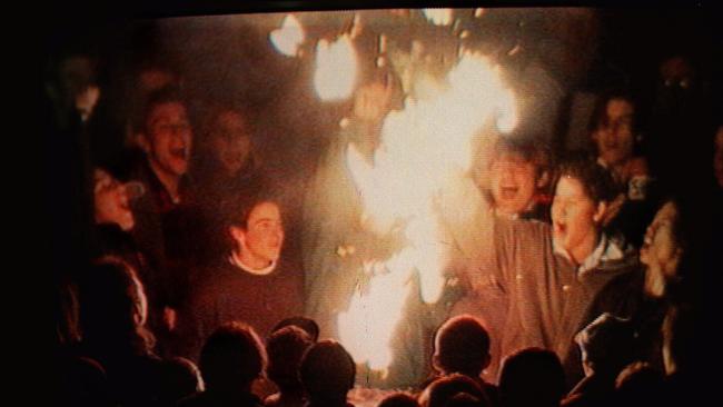 Supporters set fire to paper at Waverley Park. Picture: Optus Vision