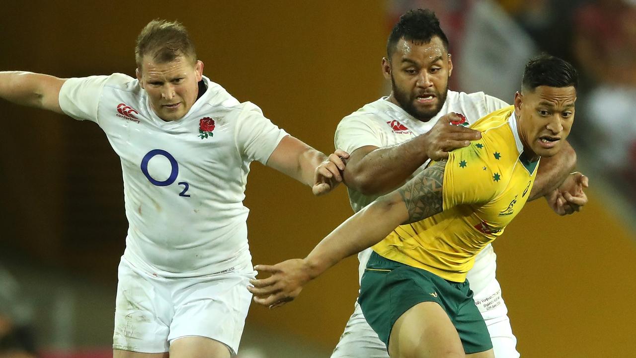 Israel Folau of Australia is held by Billy Vunipola and Dylan Hartley.