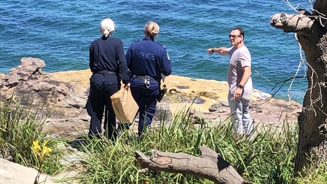 Police at the rock platform between Delwood and Fairlight beaches, where a 26-year-old North Narrabeen man was allegedly assaulted by four others on Sunday afternoon. Picture: Jim O'Rourke