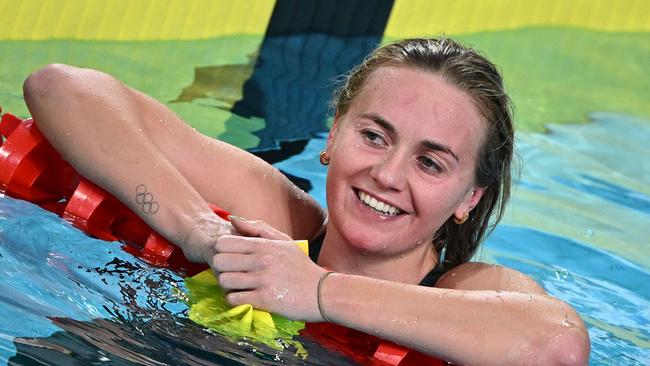 Australia's Ariarne Titmus celebrates winning and taking the gold medal