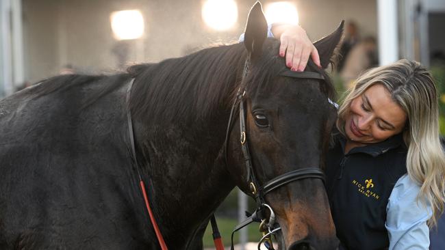 Munhamek gets a hug from strapper Zoe Miller after winning the Winter Championship Series Final. Picture: Vince Caligiuri/Getty Images