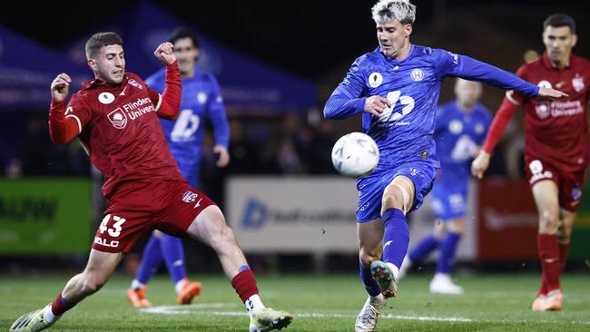 Adelaide United’s Giuseppe Bovalina tries to stop Zachary Bates of Northcote City. Picture: Daniel Pockett