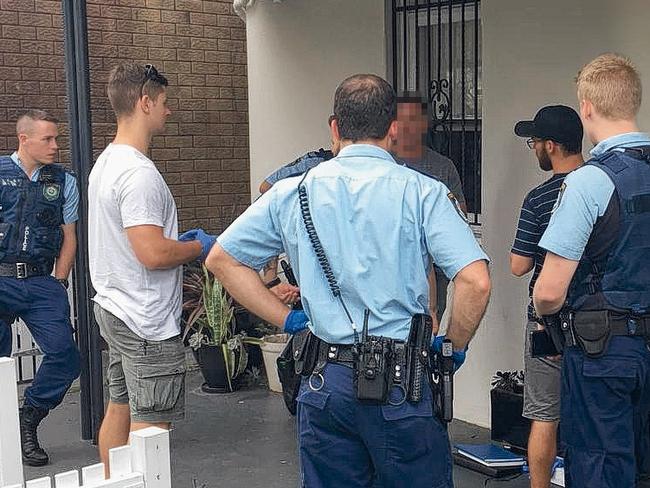 Police and undercover detectives at the scene of the arrests in Leichhardt.