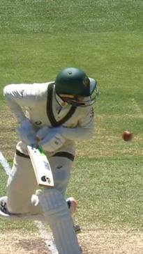 Usman Khawaja escorted off field after blow to face