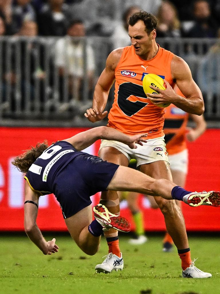 Braydon Preuss flattens David Mundy. Picture: Daniel Carson/AFL Photos via Getty Images