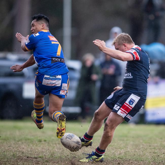 Jackson Willis has an attempted field goal charged down by Kangaroos halfback Alex Seve. News Local, Pictures by Julian Andrews.