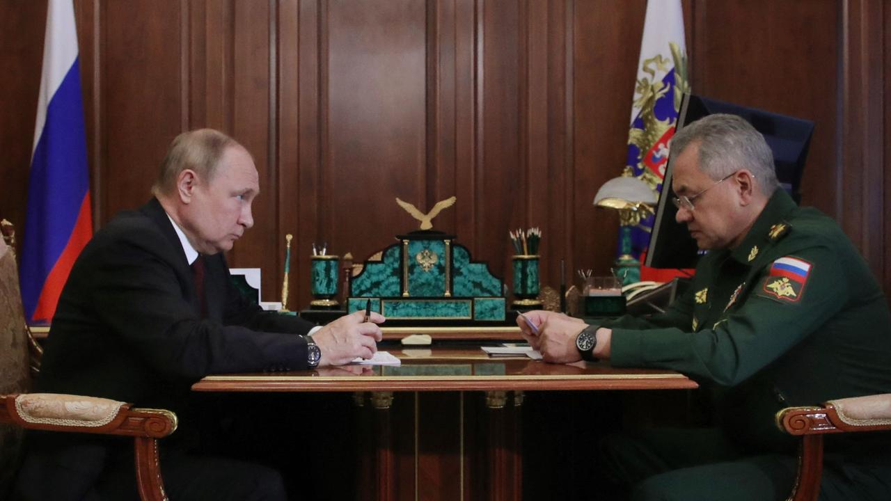 Russian President Vladimir Putin meets with Defence Minister Sergei Shoigu at the Kremlin in Moscow on July 4, 2022.