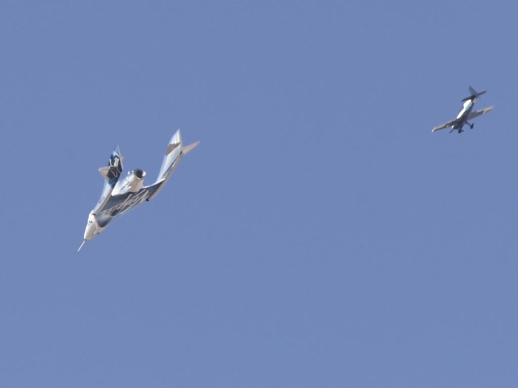 The Virgin Galactic SpaceShipTwo space plane Unity and mothership separate as they fly way above Spaceport America, above New Mexico. Picture: AFP