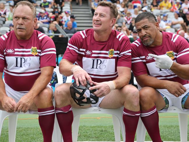 Hopoate giving the cameras the finger while sitting on the sideline alongside Manly legends Cliff Lyons and Steve Menzies. Picture: Tim Hunter.