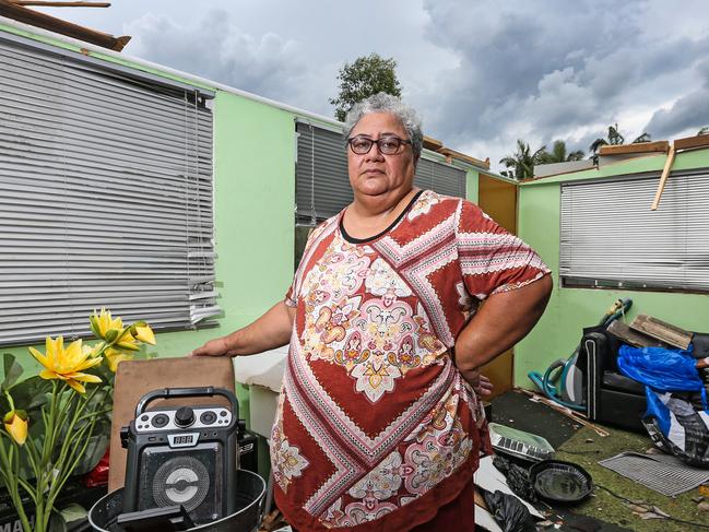 Home owner Hulita Manoa stands inside her house on Lennox Court, Logan which had the roof torn off yesterday during the wild storm.  Picture: Zak Simmonds