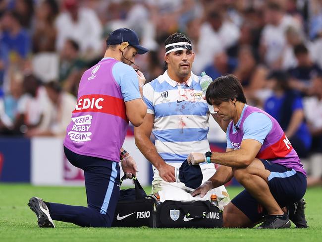 Juan Cruz Mallia receives medical attention. Picture: Cameron Spencer/Getty Images