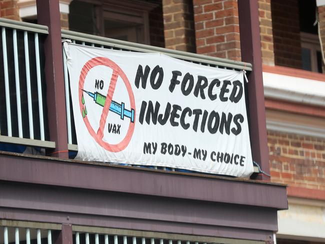 MULLUMBIMBY , AUSTRALIA - NewsWire Photos April 01, 2021: Anti Vaxxers hang protest signs 'NO FORCED INJECTIONS'  in the Main Street of Mullumbimby in reference to the Covid-19 roll out of a vaccination..Picture: NCA NewsWire / Scott Powick